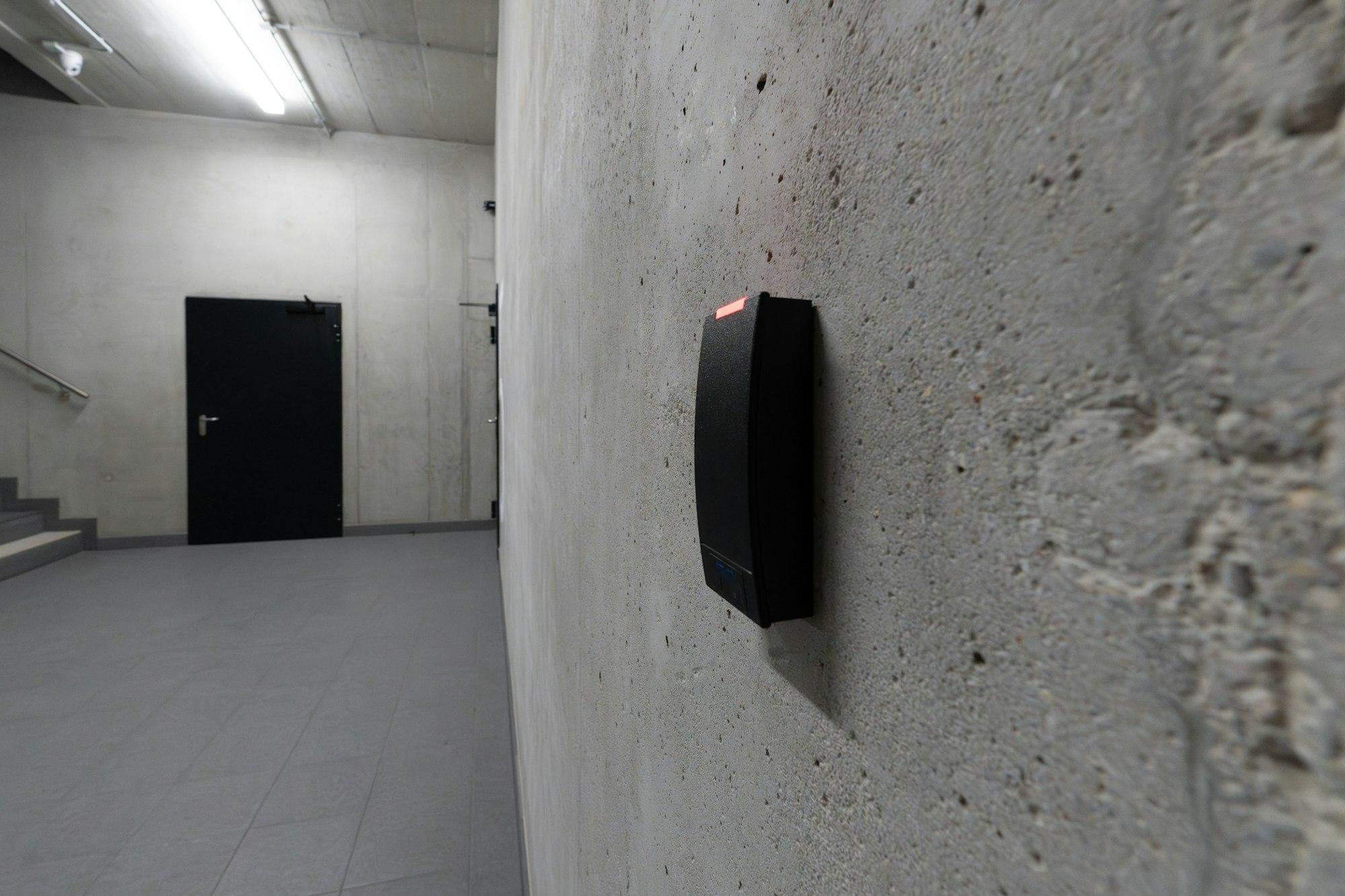 Modern access control card reader mounted on wall