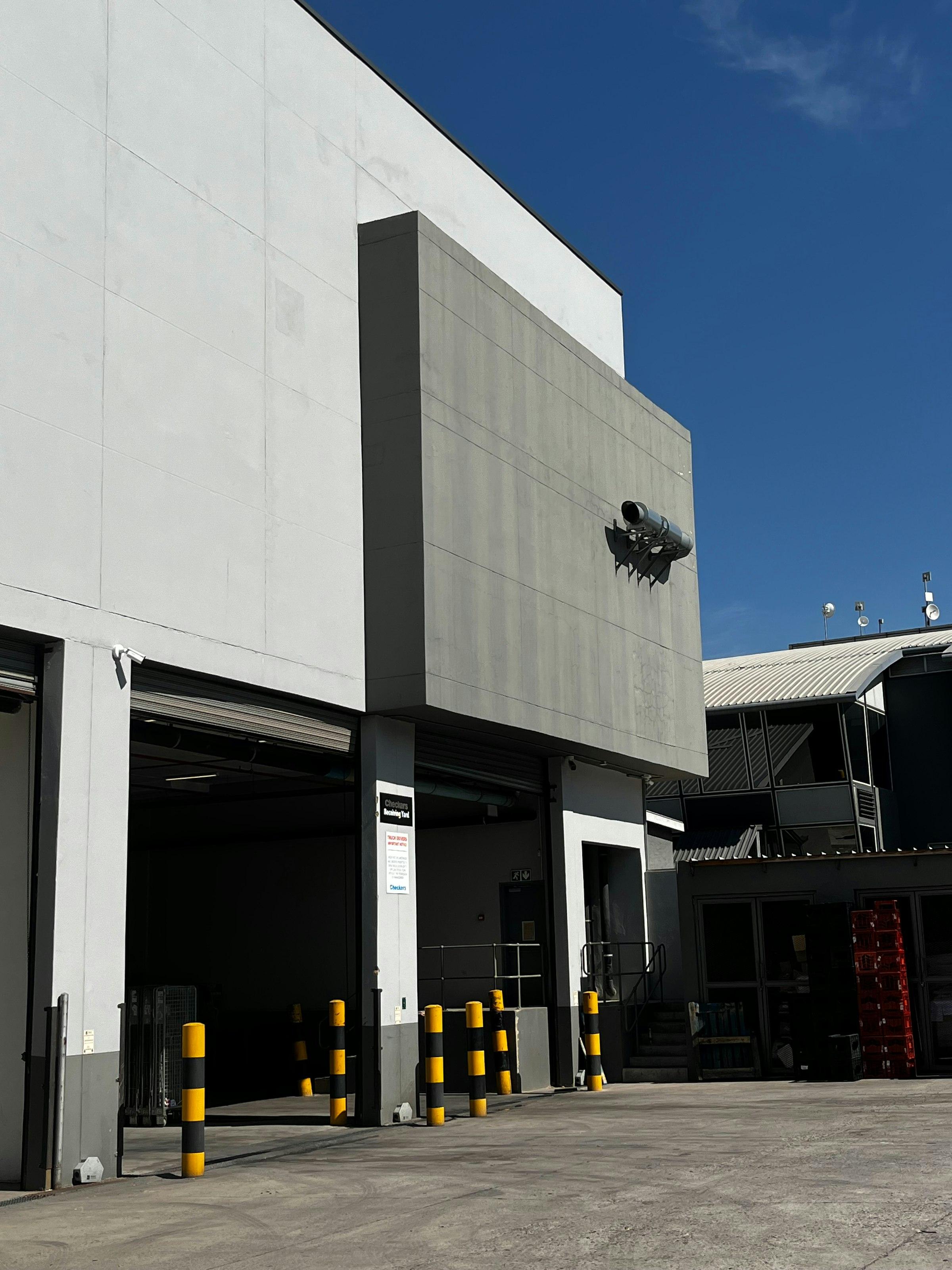 Commercial security camera installation on modern facility