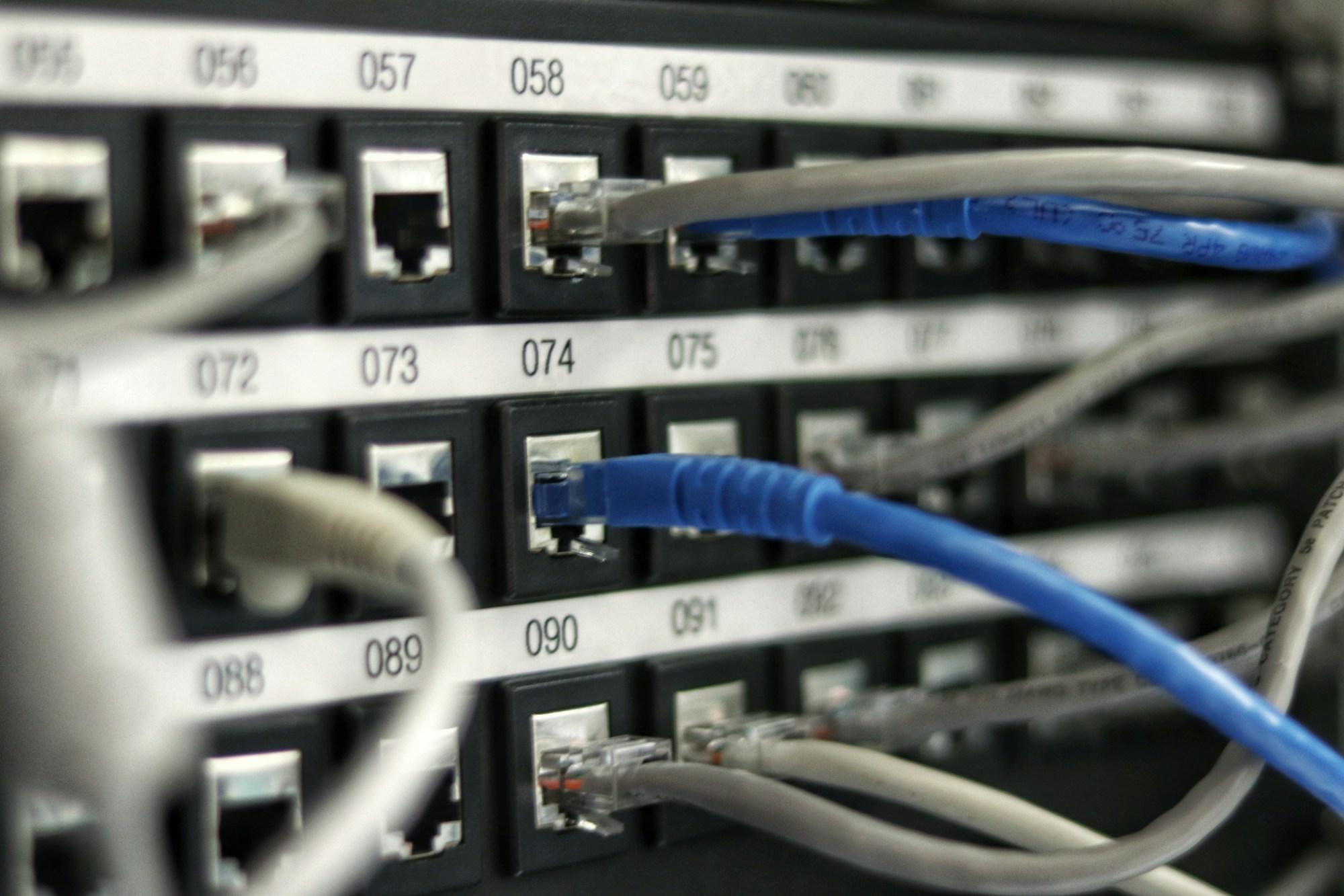 Numbered ethernet patch panel with organized CAT6 cabling